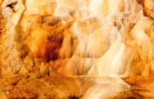 limestone terraces colored shades of rust by thermophilic bacteria